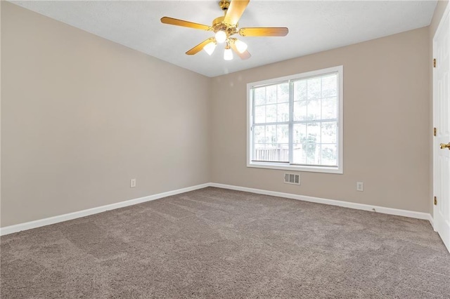 carpeted empty room with ceiling fan