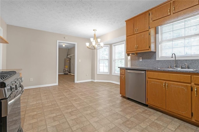 kitchen featuring sink, hanging light fixtures, gas water heater, a notable chandelier, and appliances with stainless steel finishes