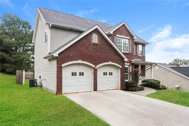 view of front of home featuring central AC unit, a garage, and a front lawn