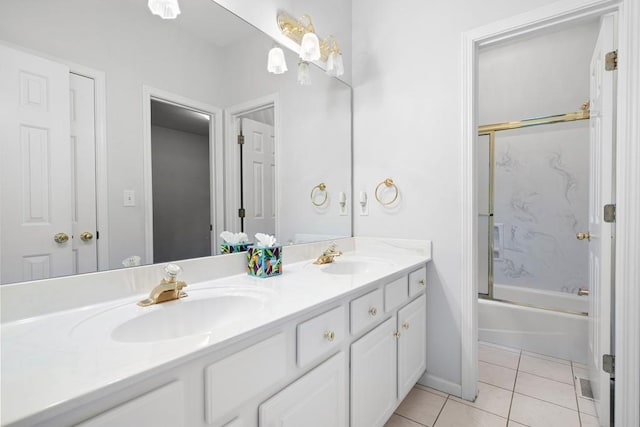 bathroom featuring vanity, tile patterned floors, and shower / bath combination with glass door