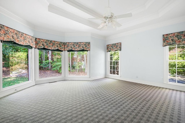 empty room with carpet, ornamental molding, plenty of natural light, and ceiling fan