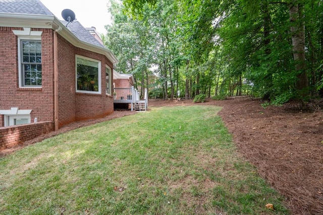 view of yard featuring a deck