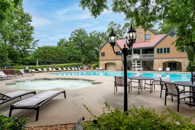 view of swimming pool with a patio area