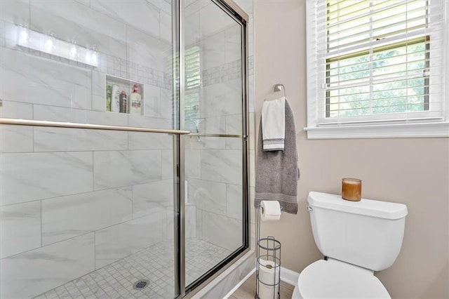 10 Shadow Ln, Cartersville, GA 30120 - bathroom with toilet, a stall shower, and baseboards