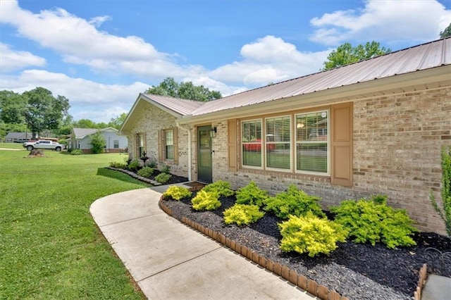 10 Shadow Ln, Cartersville, GA 30120 - view of side of home with a lawn, metal roof, and brick siding