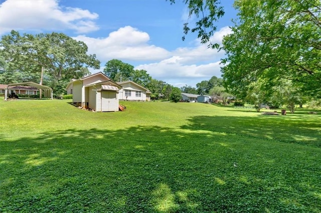 10 Shadow Ln, Cartersville, GA 30120 - view of green lawn with a carport