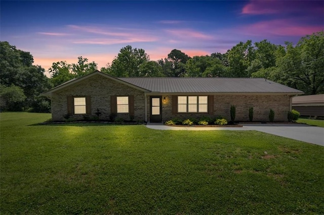 10 Shadow Ln, Cartersville, GA 30120 - ranch-style home featuring a front yard, concrete driveway, brick siding, and metal roof