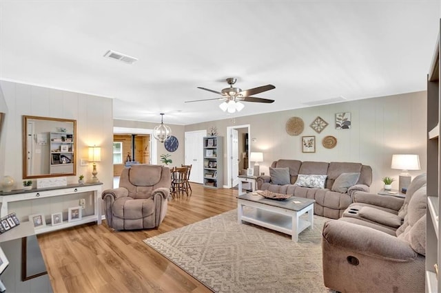 10 Shadow Ln, Cartersville, GA 30120 - living room featuring wood finished floors, a ceiling fan, and a chandelier
