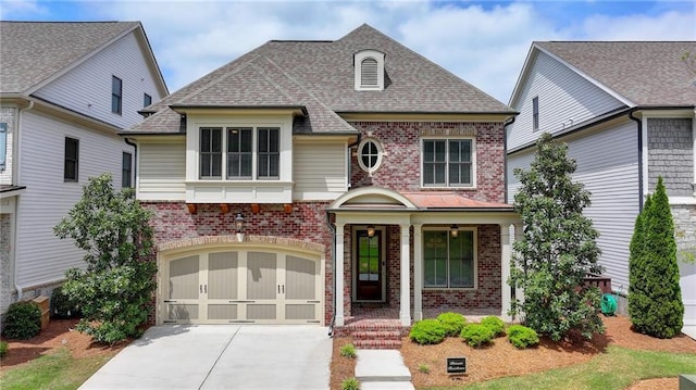 view of front facade featuring brick siding, a shingled roof, a garage, and concrete driveway