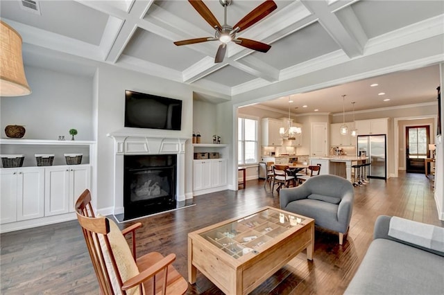 living room featuring ceiling fan with notable chandelier, recessed lighting, dark wood-type flooring, visible vents, and coffered ceiling