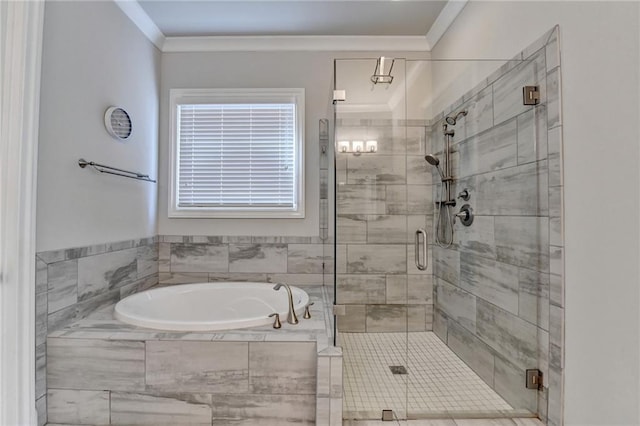 bathroom featuring crown molding, a shower stall, and a garden tub