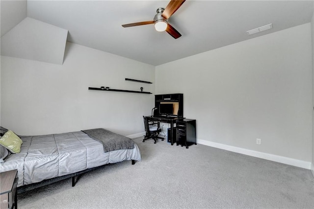 carpeted bedroom with baseboards, visible vents, ceiling fan, and vaulted ceiling