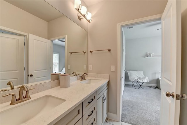 full bathroom featuring a sink, baseboards, double vanity, and visible vents