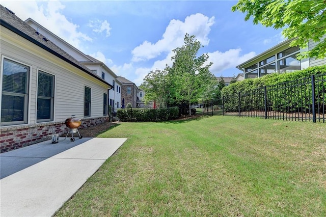 view of yard with fence and a patio