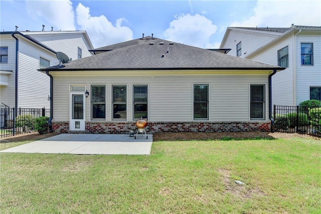 rear view of house featuring a patio, fence, and brick siding
