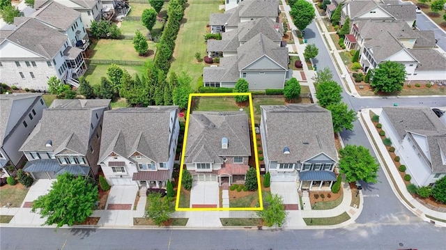 birds eye view of property with a residential view