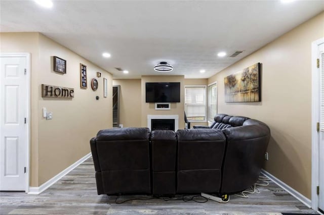 4424 English Loop, Stonecrest, GA 30038 - living area featuring wood finished floors, baseboards, a fireplace, and recessed lighting