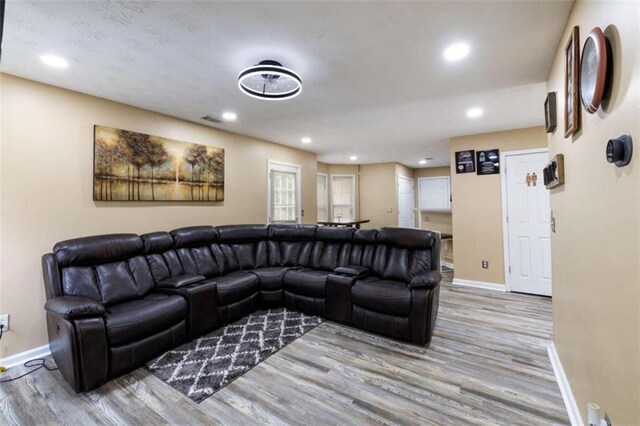 4424 English Loop, Stonecrest, GA 30038 - living room featuring baseboards, wood finished floors, and recessed lighting