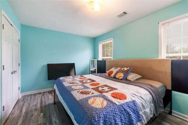 4424 English Loop, Stonecrest, GA 30038 - bedroom with wood finished floors, baseboards, and a closet