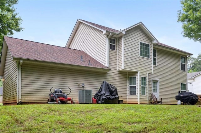 4424 English Loop, Stonecrest, GA 30038 - rear view of property with roof with shingles, a yard, and central AC