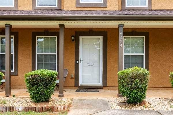 4424 English Loop, Stonecrest, GA 30038 - entrance to property with covered porch and stucco siding