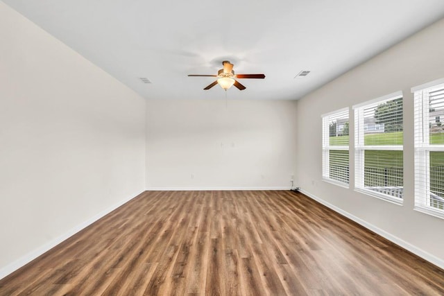 1530 Avalon Creek Rd, Sugar Hill, GA 30518 - empty room with wood finished floors, baseboards, and ceiling fan