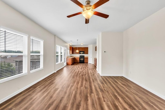 1530 Avalon Creek Rd, Sugar Hill, GA 30518 - unfurnished living room featuring dark wood-style floors, baseboards, and ceiling fan
