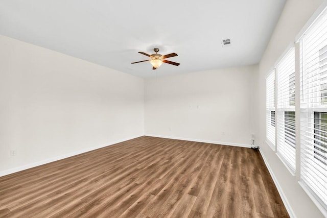 1530 Avalon Creek Rd, Sugar Hill, GA 30518 - unfurnished room with wood finished floors, ceiling fan, and baseboards