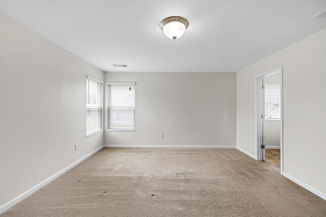 1530 Avalon Creek Rd, Sugar Hill, GA 30518 - spare room with healthy amount of natural light, light colored carpet, and baseboards