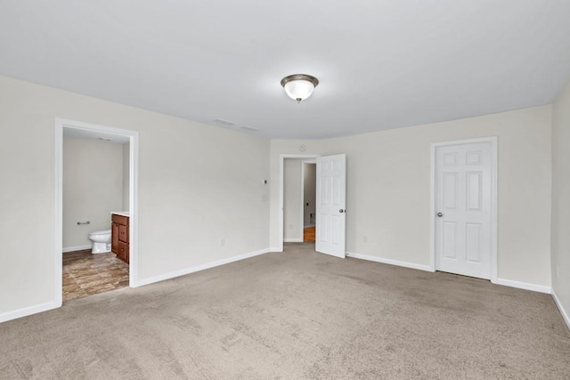 1530 Avalon Creek Rd, Sugar Hill, GA 30518 - unfurnished bedroom with carpet floors, baseboards, and ensuite bath