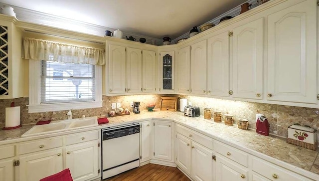 kitchen with white cabinetry, sink, dark hardwood / wood-style floors, backsplash, and white dishwasher