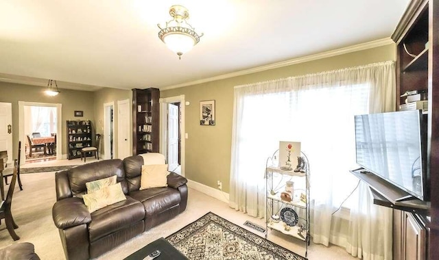 carpeted living room with ornamental molding