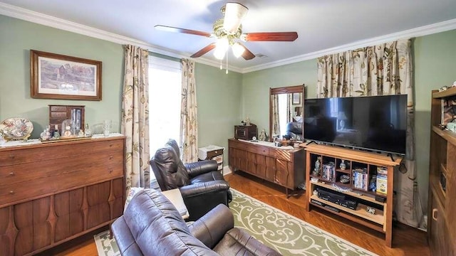 living room with wood-type flooring, ceiling fan, and crown molding