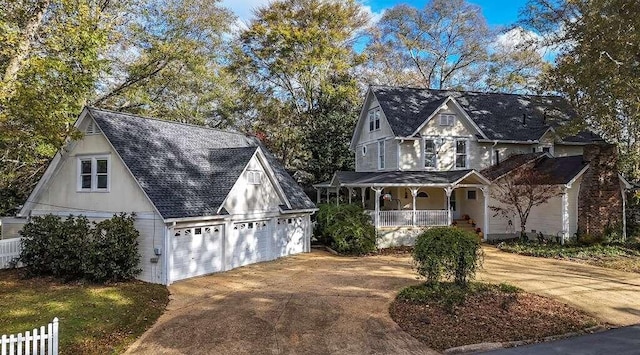 view of front of property with a porch and a garage