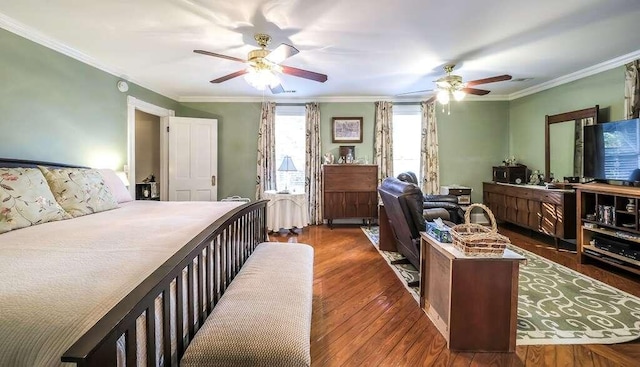 bedroom with ceiling fan, crown molding, and dark wood-type flooring