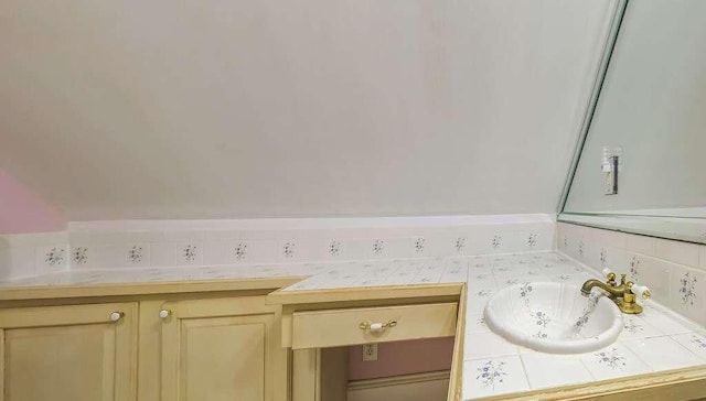 interior space featuring decorative backsplash and sink