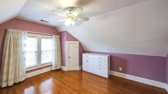 bonus room with hardwood / wood-style flooring, vaulted ceiling, and ceiling fan