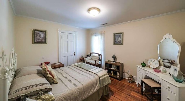bedroom with crown molding and dark wood-type flooring