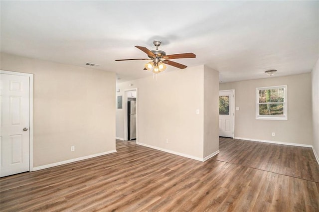 unfurnished room with ceiling fan and hardwood / wood-style flooring