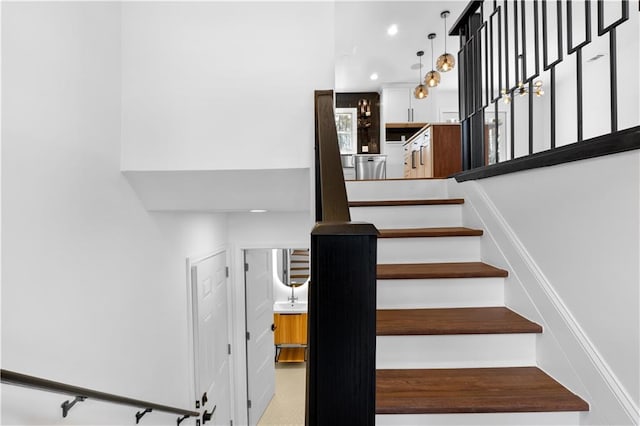 staircase featuring recessed lighting