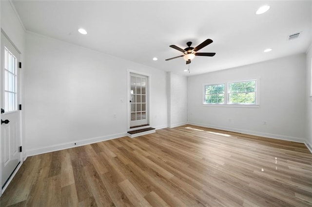 spare room featuring ceiling fan and light wood-type flooring