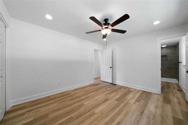 unfurnished bedroom featuring ceiling fan and light wood-type flooring