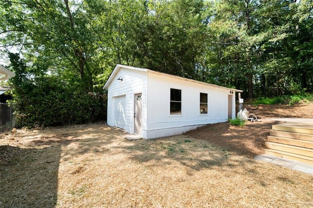 view of outbuilding featuring a garage