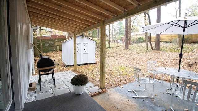 view of patio featuring a storage unit