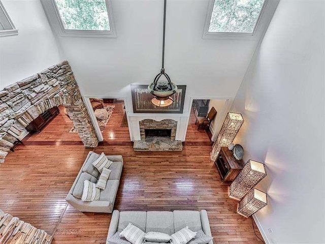 living room featuring hardwood / wood-style flooring and a fireplace