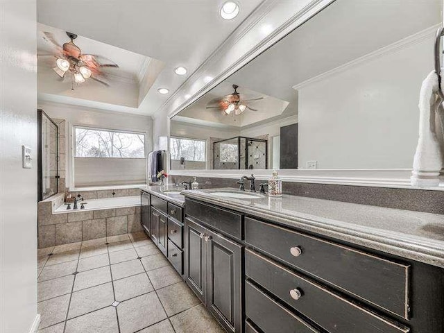 bathroom with vanity, a ceiling fan, crown molding, a bath, and tile patterned floors