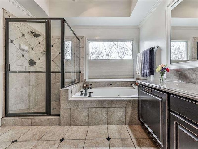 full bath with a garden tub, a healthy amount of sunlight, and a stall shower