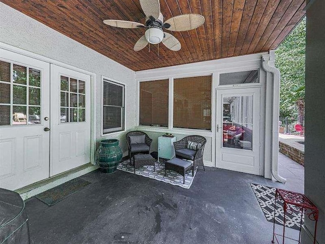 view of patio with french doors and ceiling fan