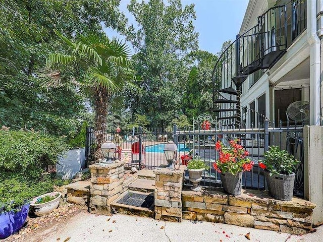 view of patio / terrace featuring a fenced in pool and fence