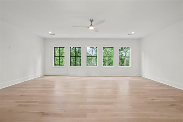 4785 Merlendale Ct, Atlanta, GA 30327 - spare room with healthy amount of natural light, baseboards, ceiling fan, light wood finished floors, and recessed lighting